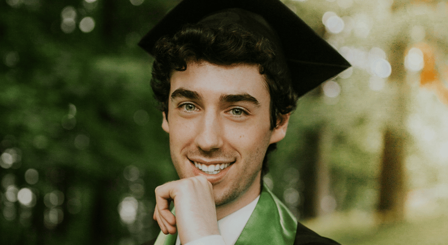 young man in a graduation cap and gown