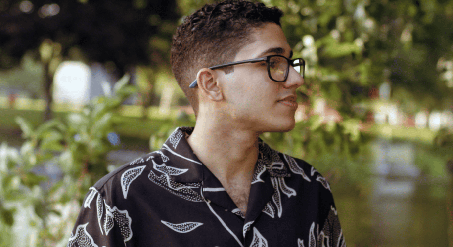 side profile photo of a kid with glasses
