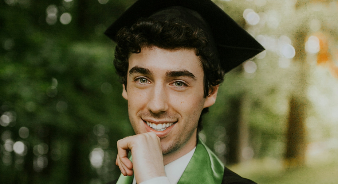 young man in a graduation cap and gown